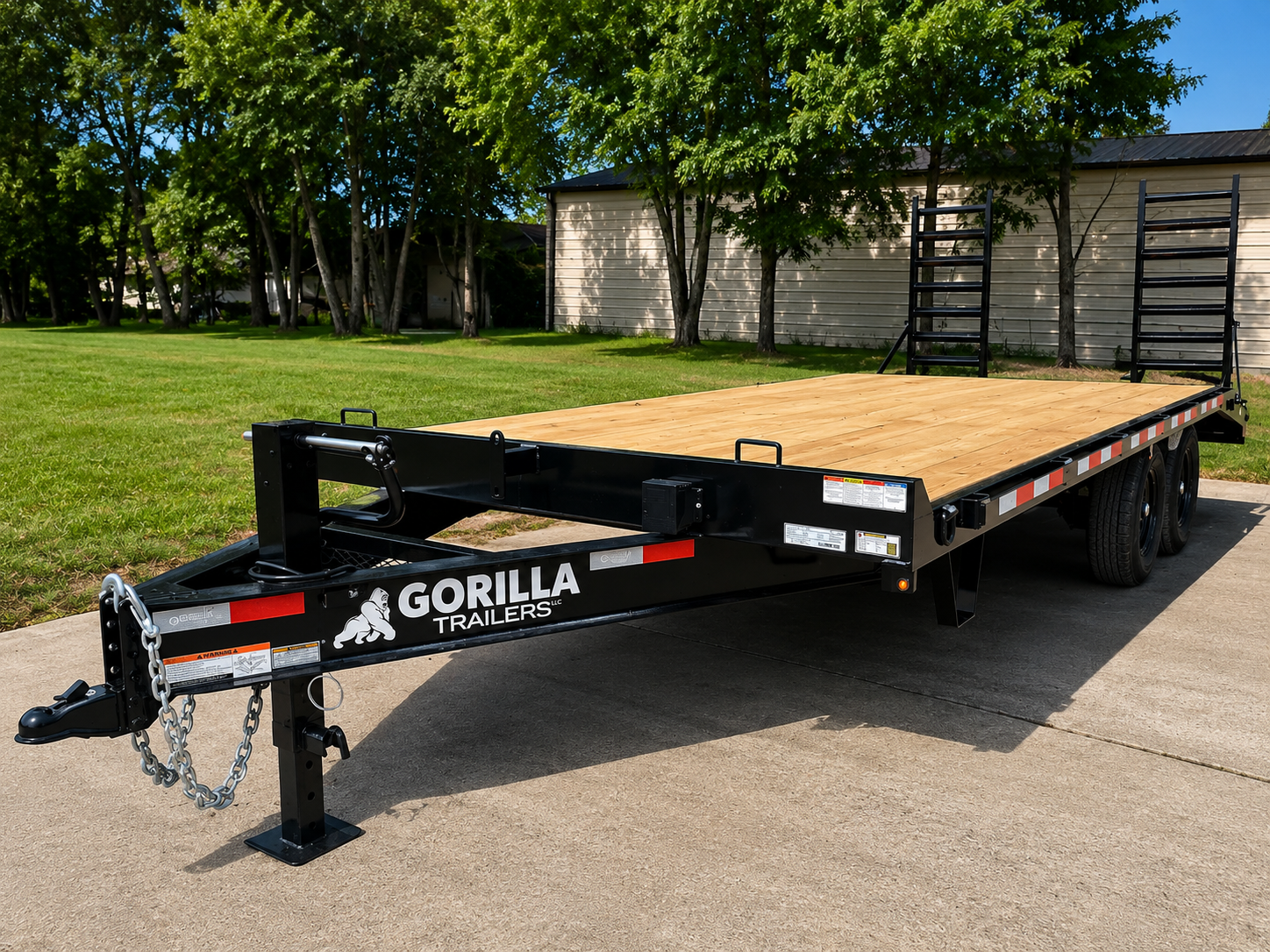 Gorilla Trailers black bumper-pull deckover flatbed trailer with wood deck and jack stand