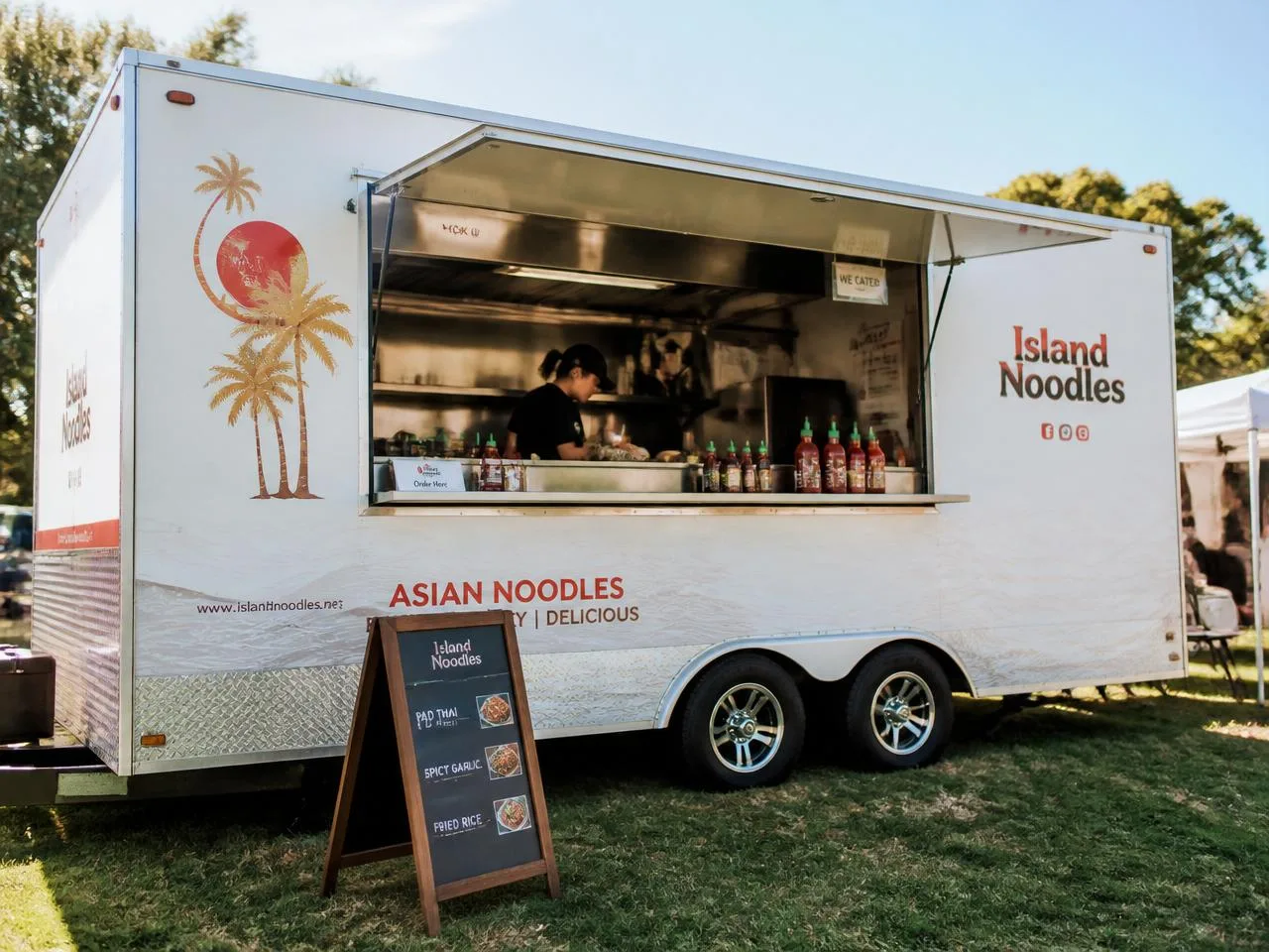 Realistic silver concession food trailer with serving window and propane tanks