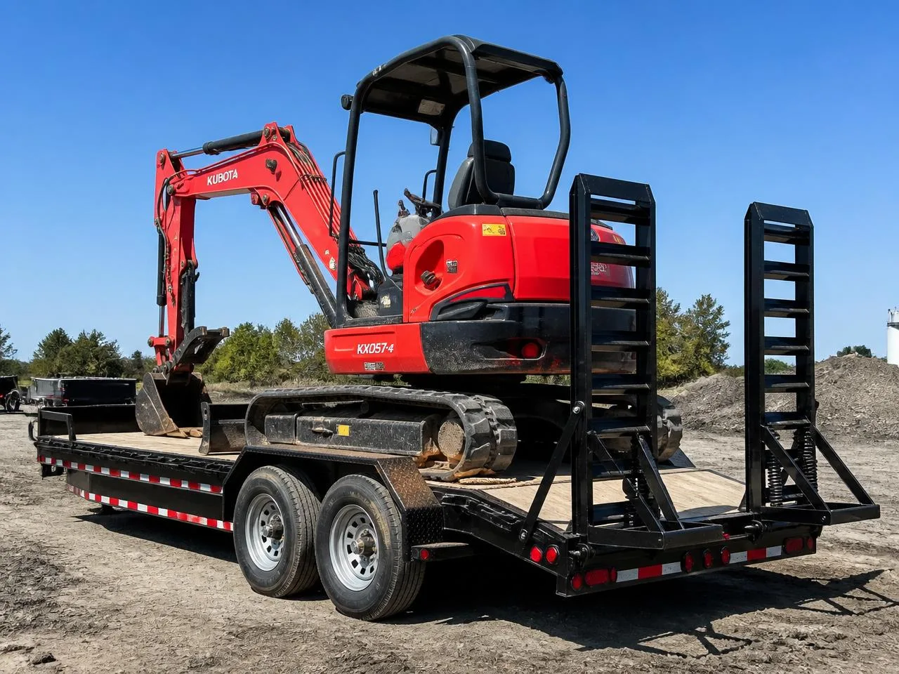 Equipment trailer with fold-down ramps